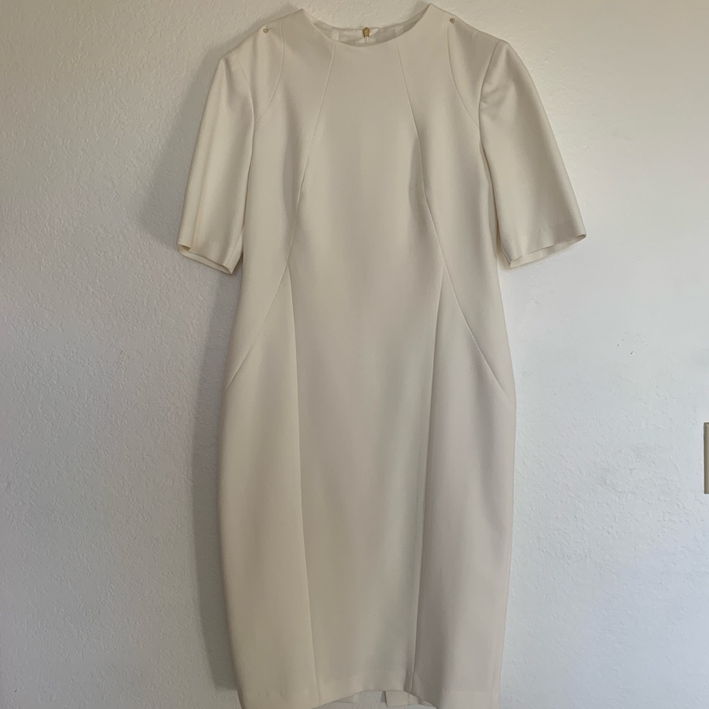 This Trina Turk dress in size six is perfect white with no stains or marks.